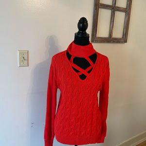 Red sweater high neck with cris cross cut out in the front